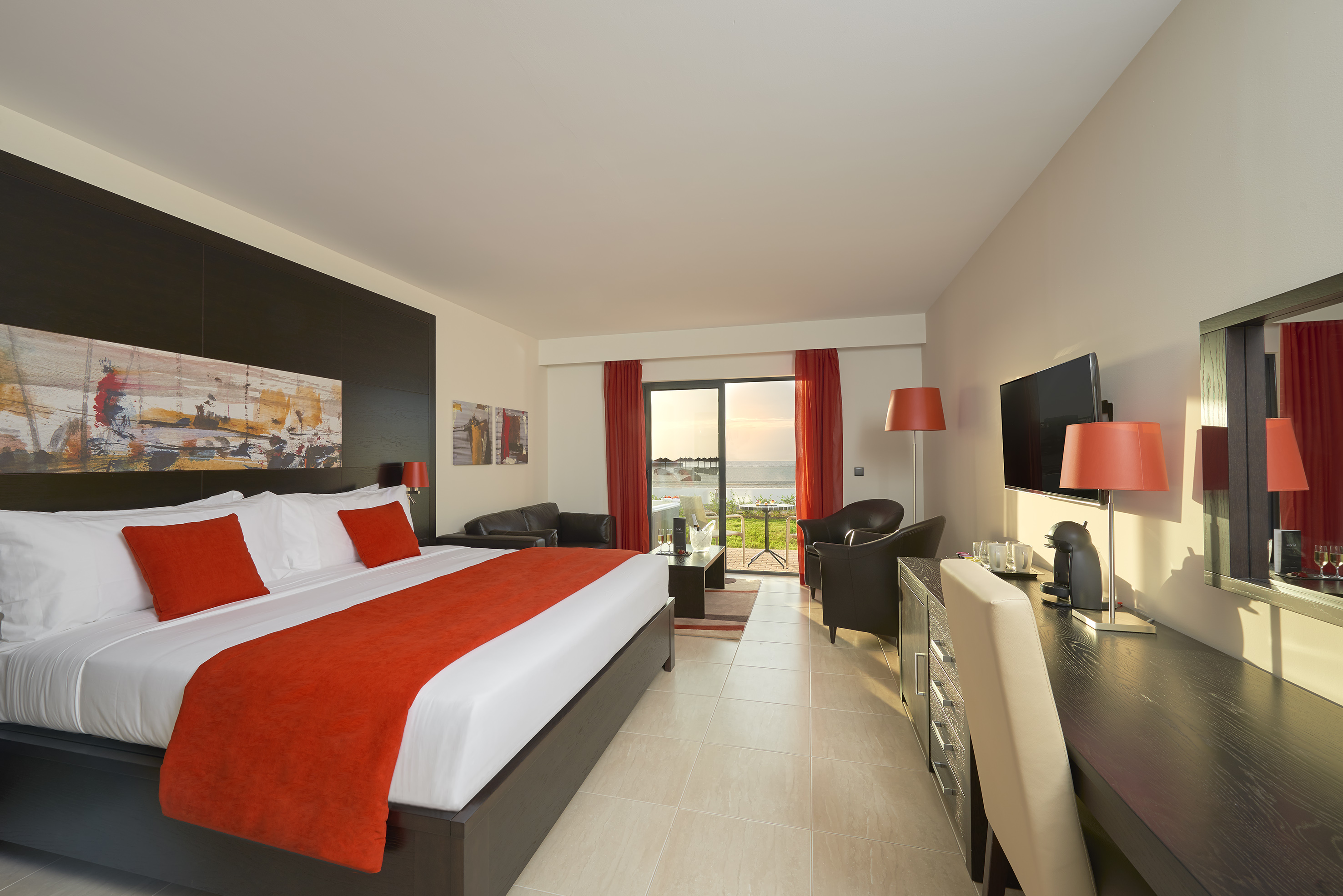 a room with a bed and a television