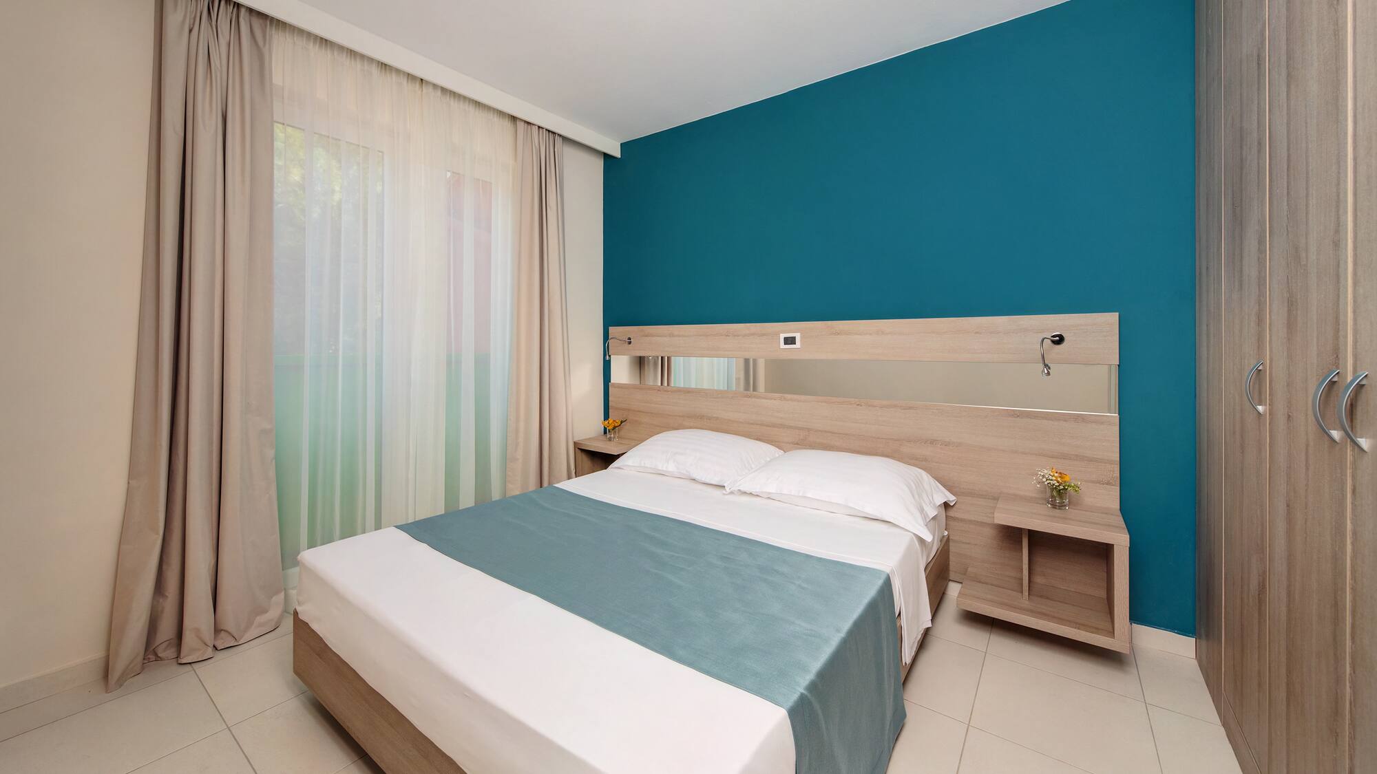 a bed with a mirror in a room