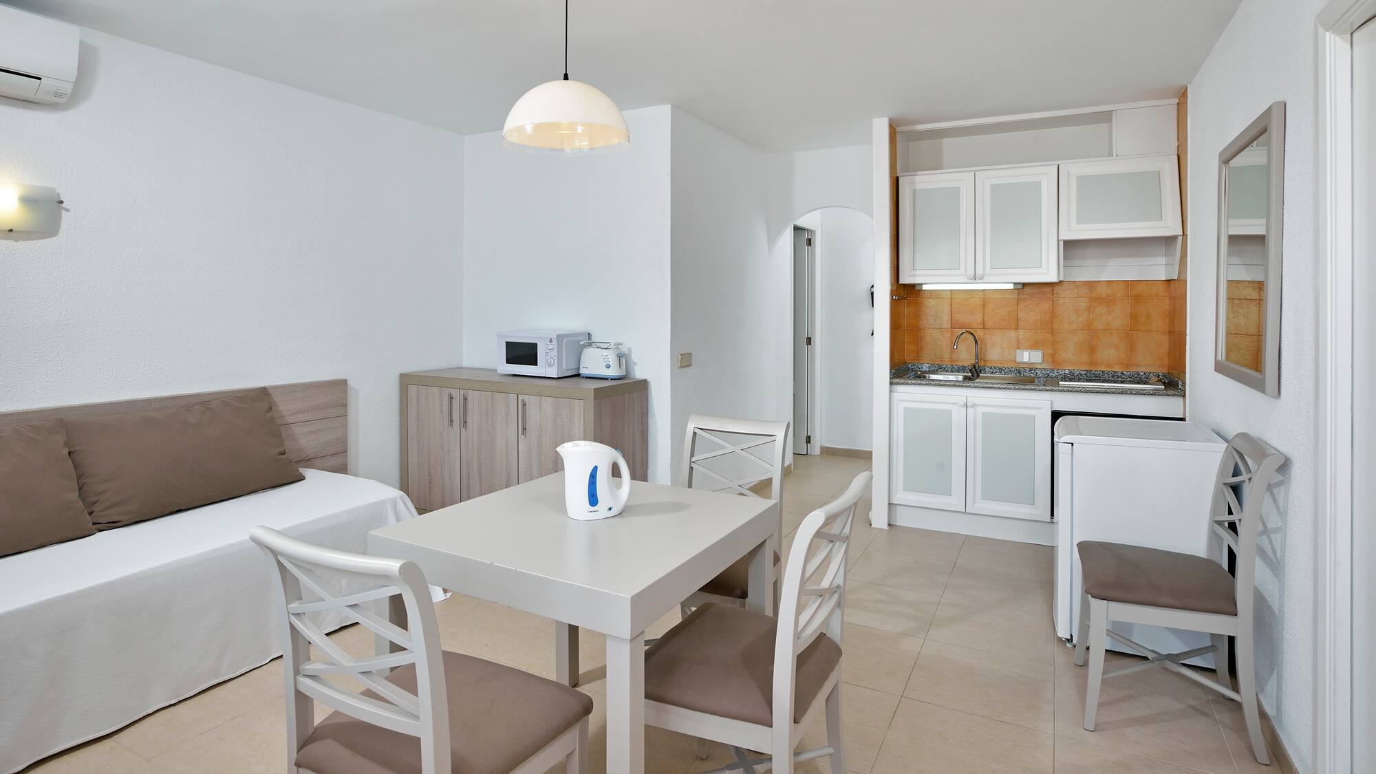 a room with a table and chairs