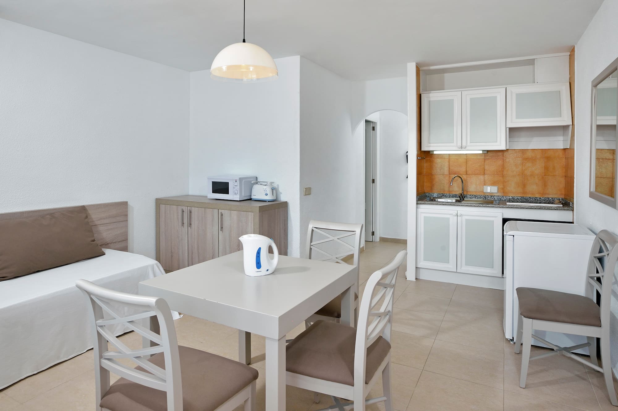 a room with a table and chairs