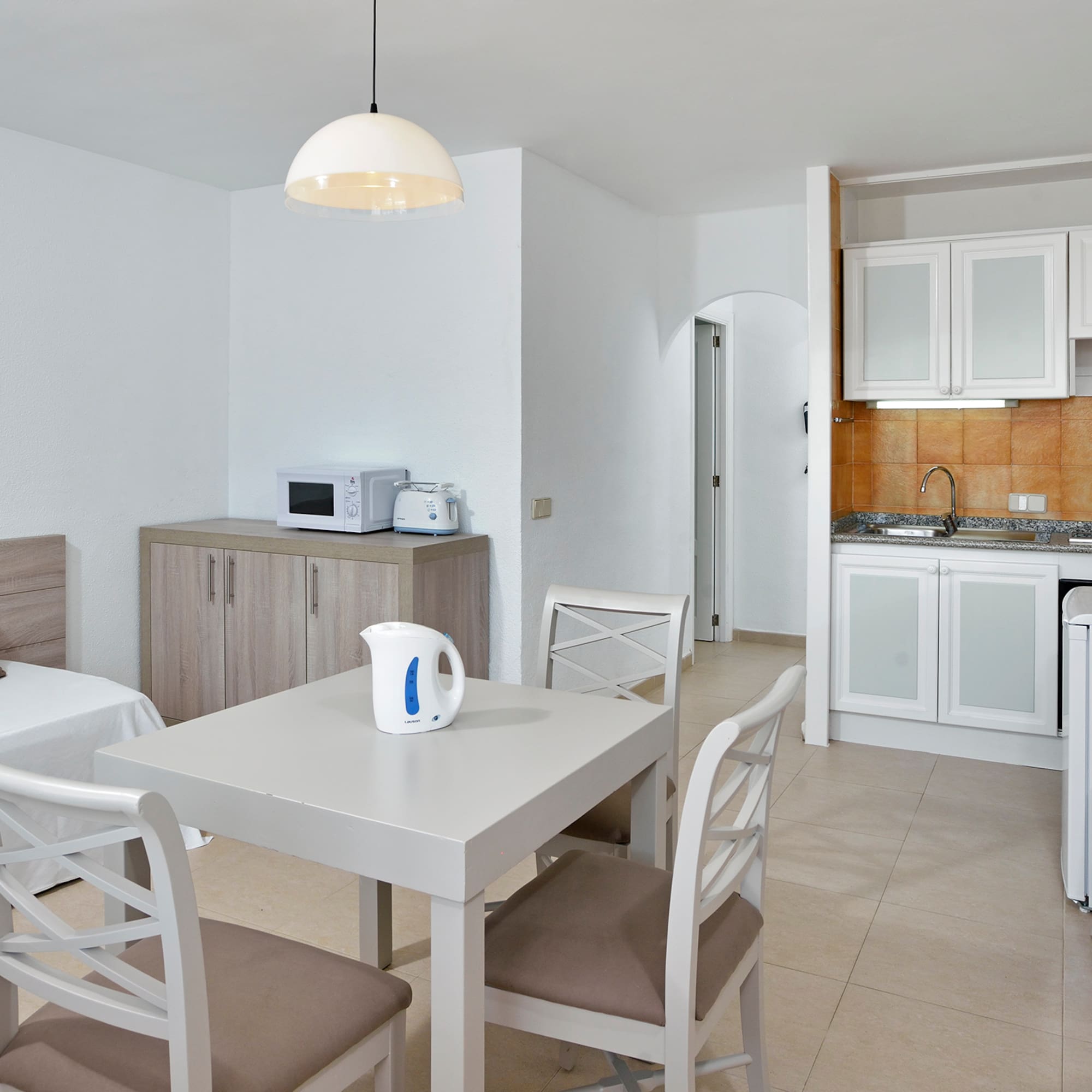 a room with a table and chairs