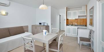 a room with a table and chairs