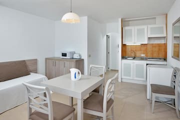 a room with a table and chairs