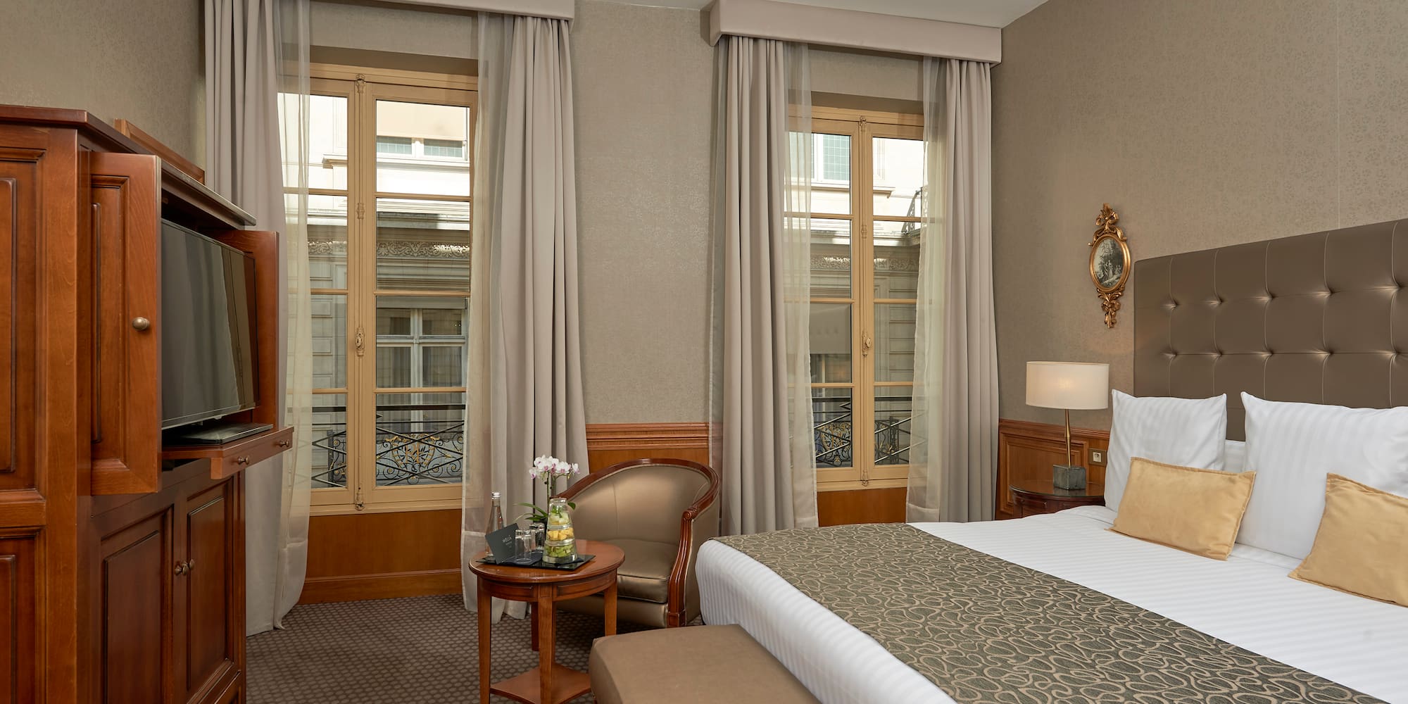 a room with a bed and a television