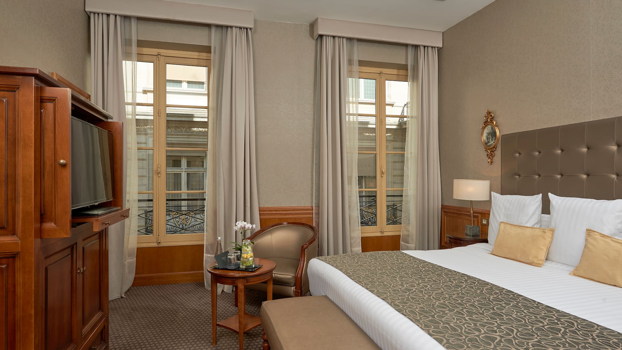 a room with a bed and a television