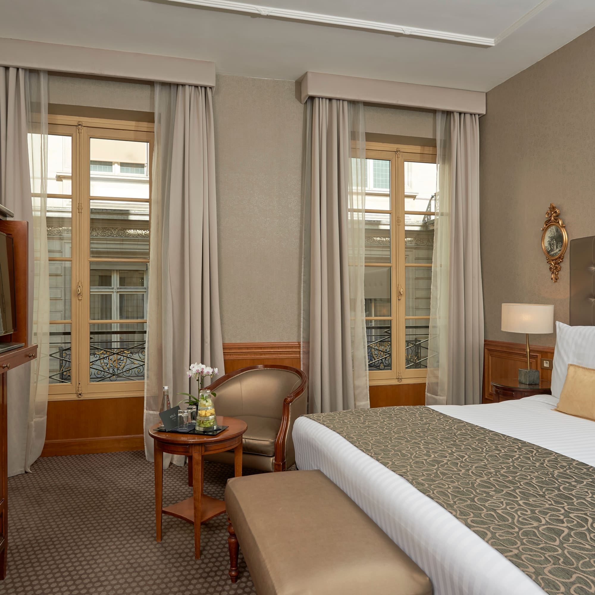 a room with a bed and a television