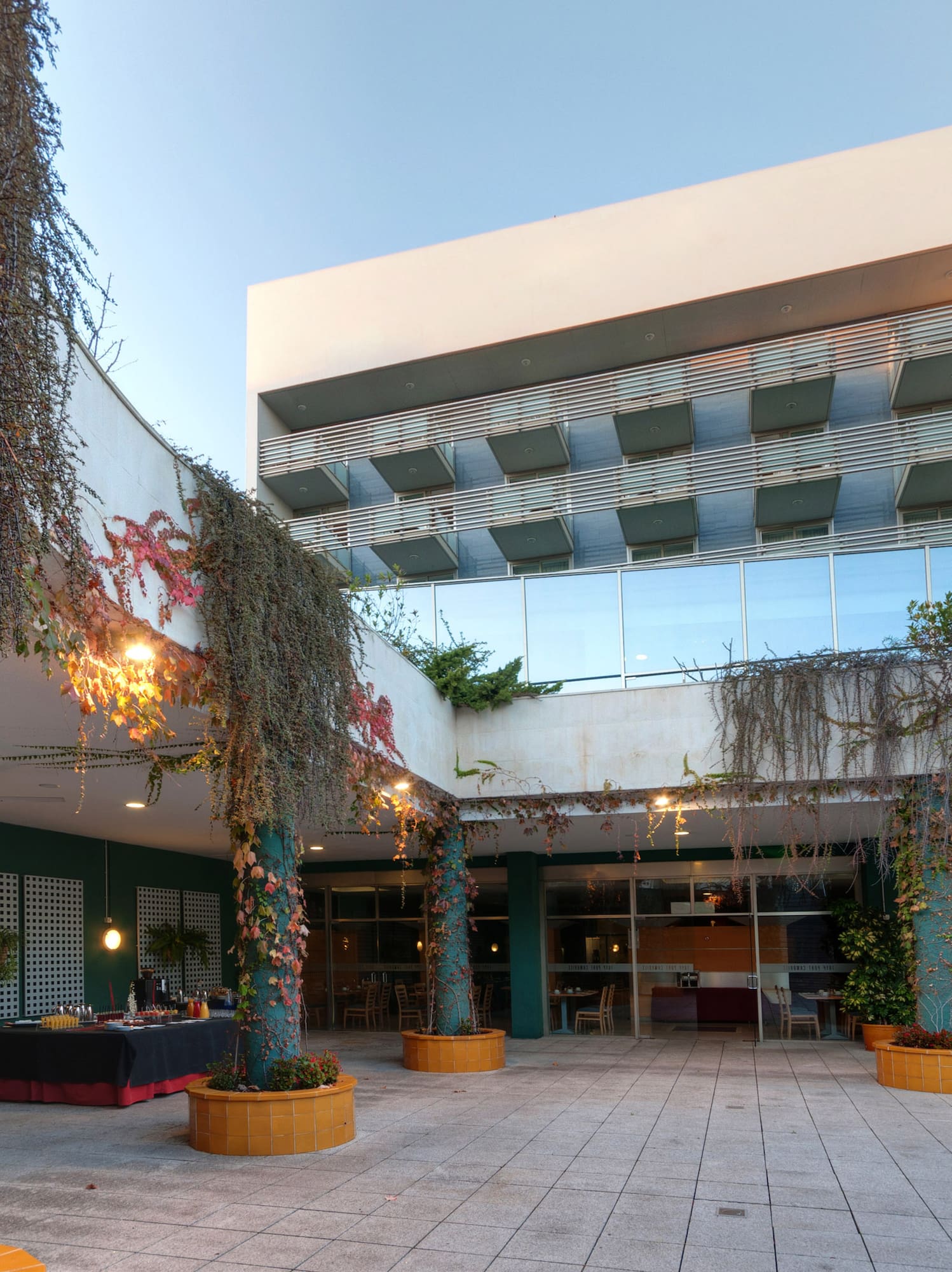 a building with trees and plants around it