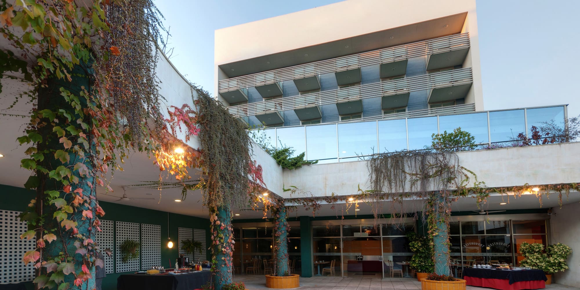 a building with trees and plants around it