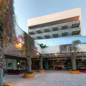 a building with trees and plants around it