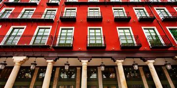 a red building with white columns