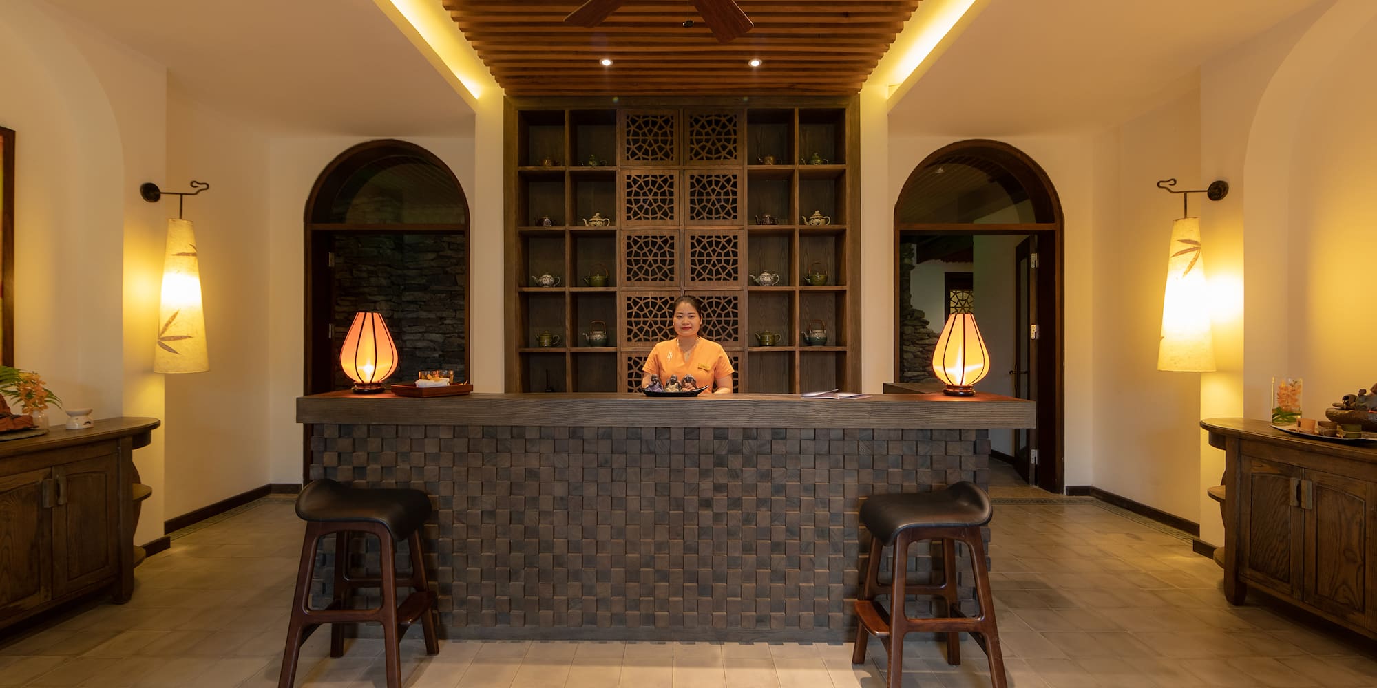 a woman standing at a counter in a room