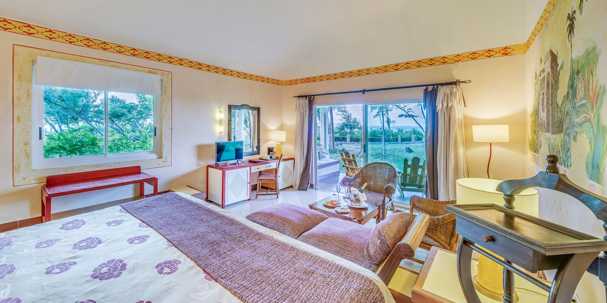 a room with a bed and a desk and chair