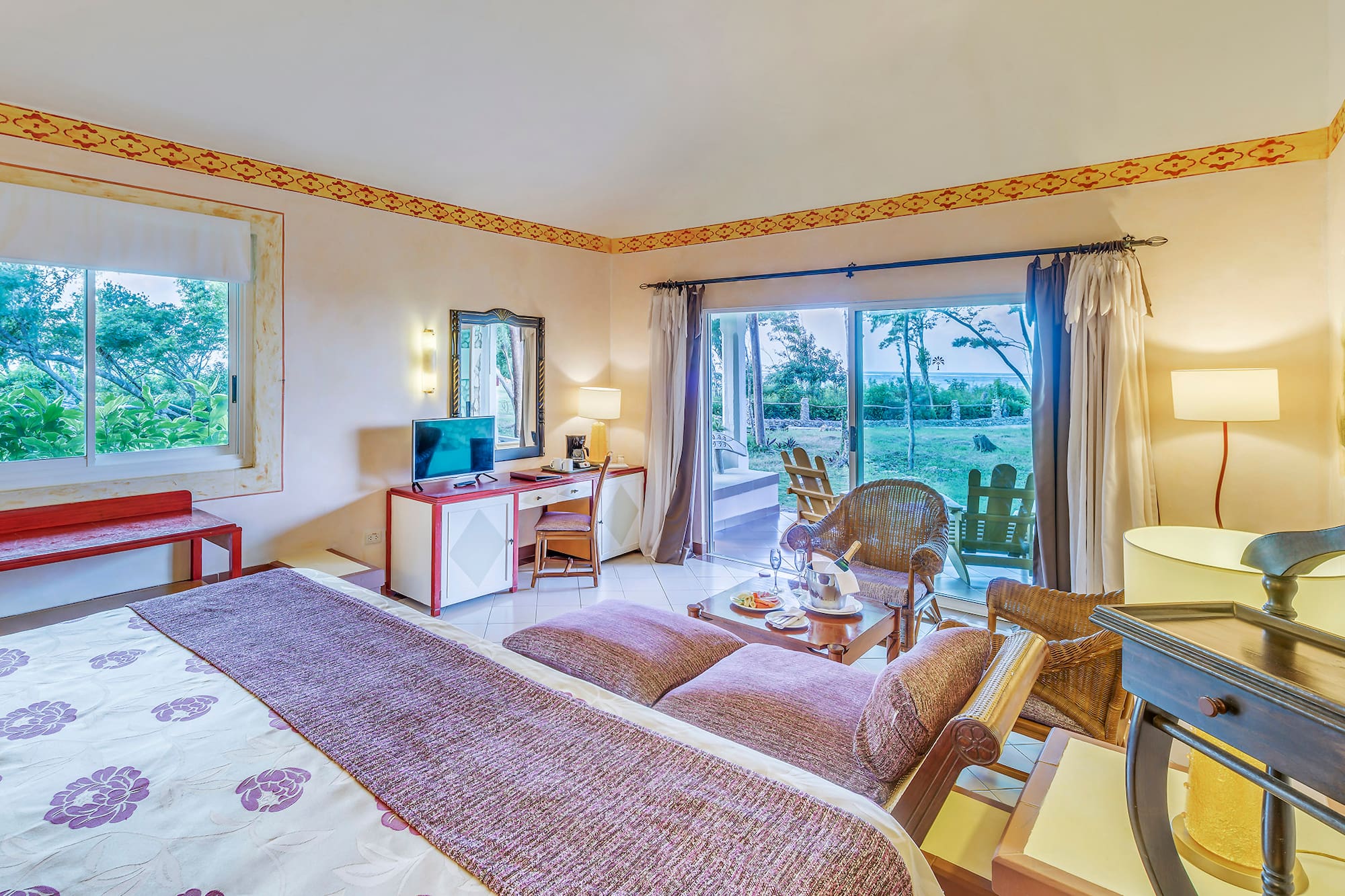 a room with a bed and a desk and chair