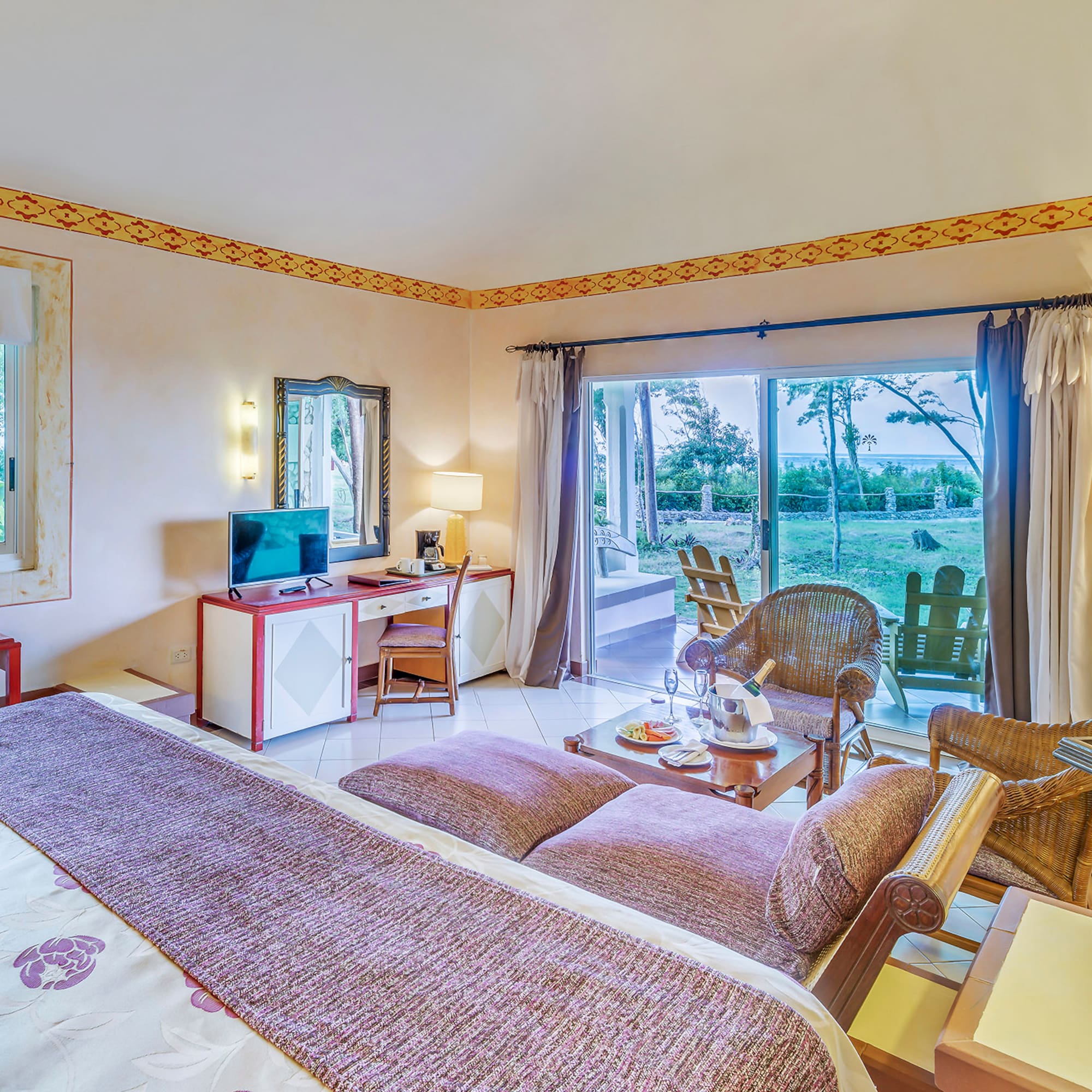 a room with a bed and a desk and chair