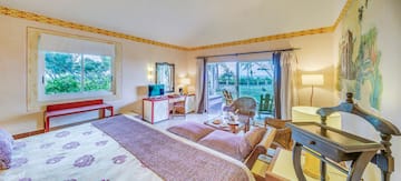 a room with a bed and a desk and chair