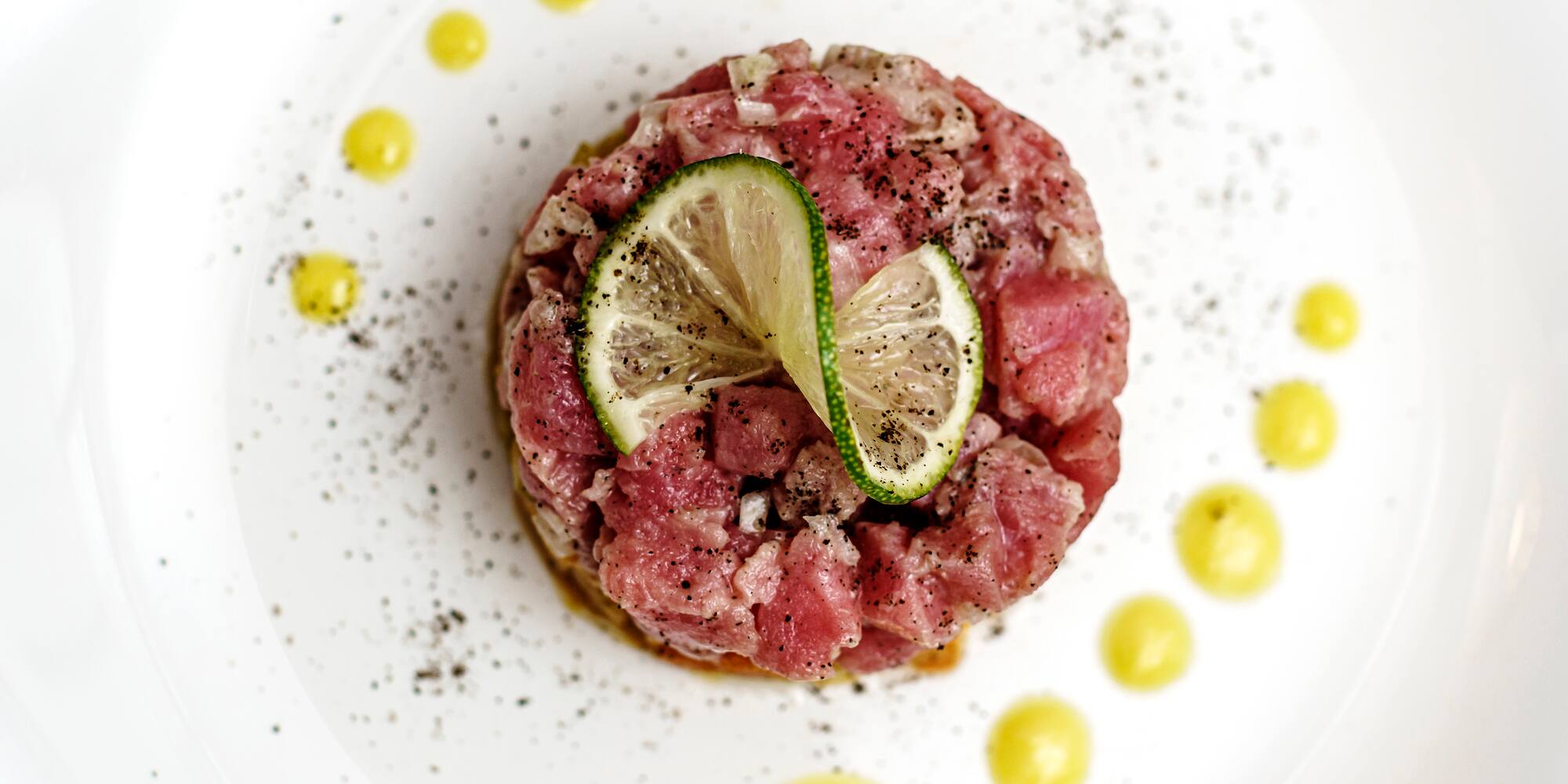 a plate of food with a lime wedge on top