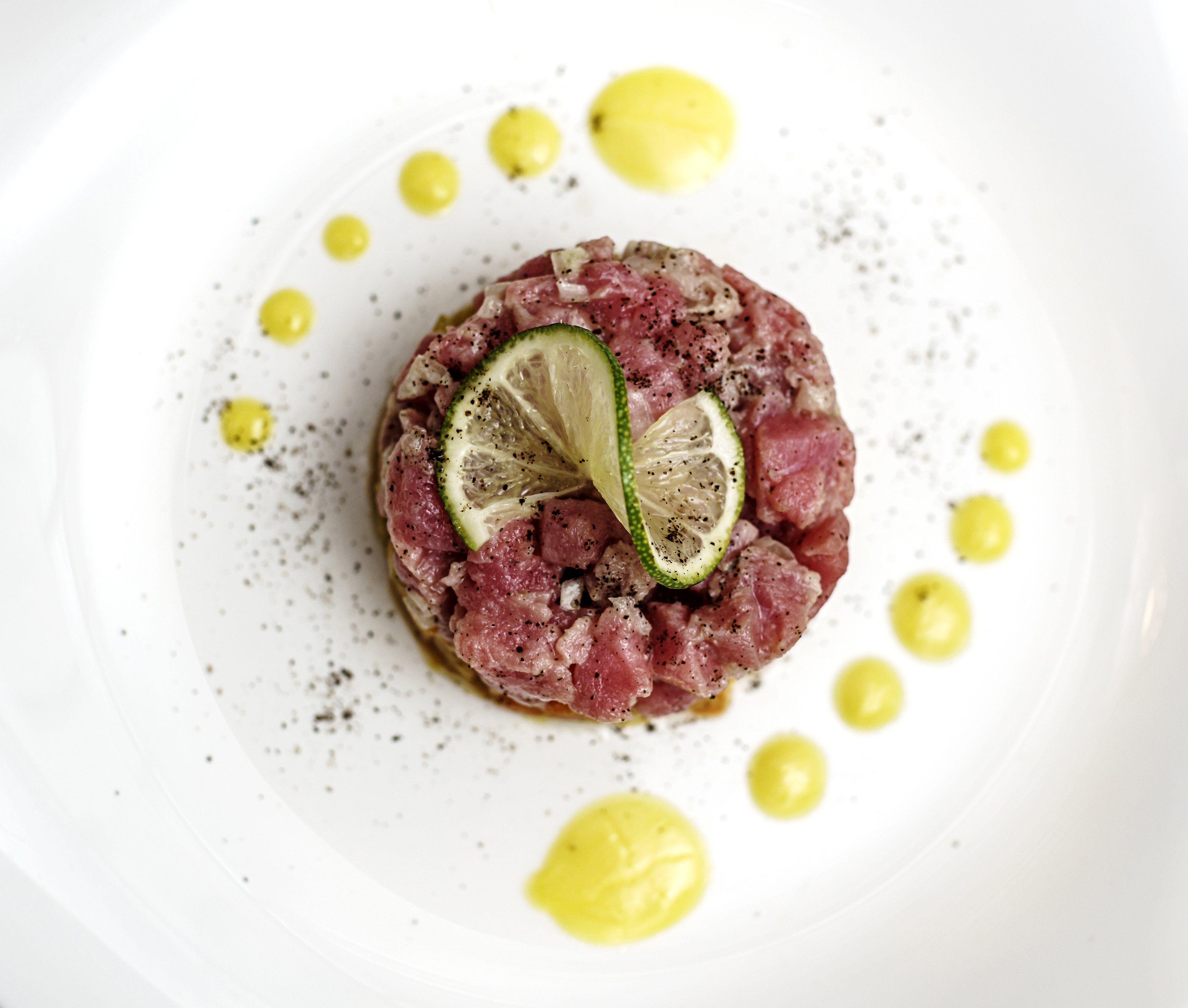 a plate of food with a lime wedge on top