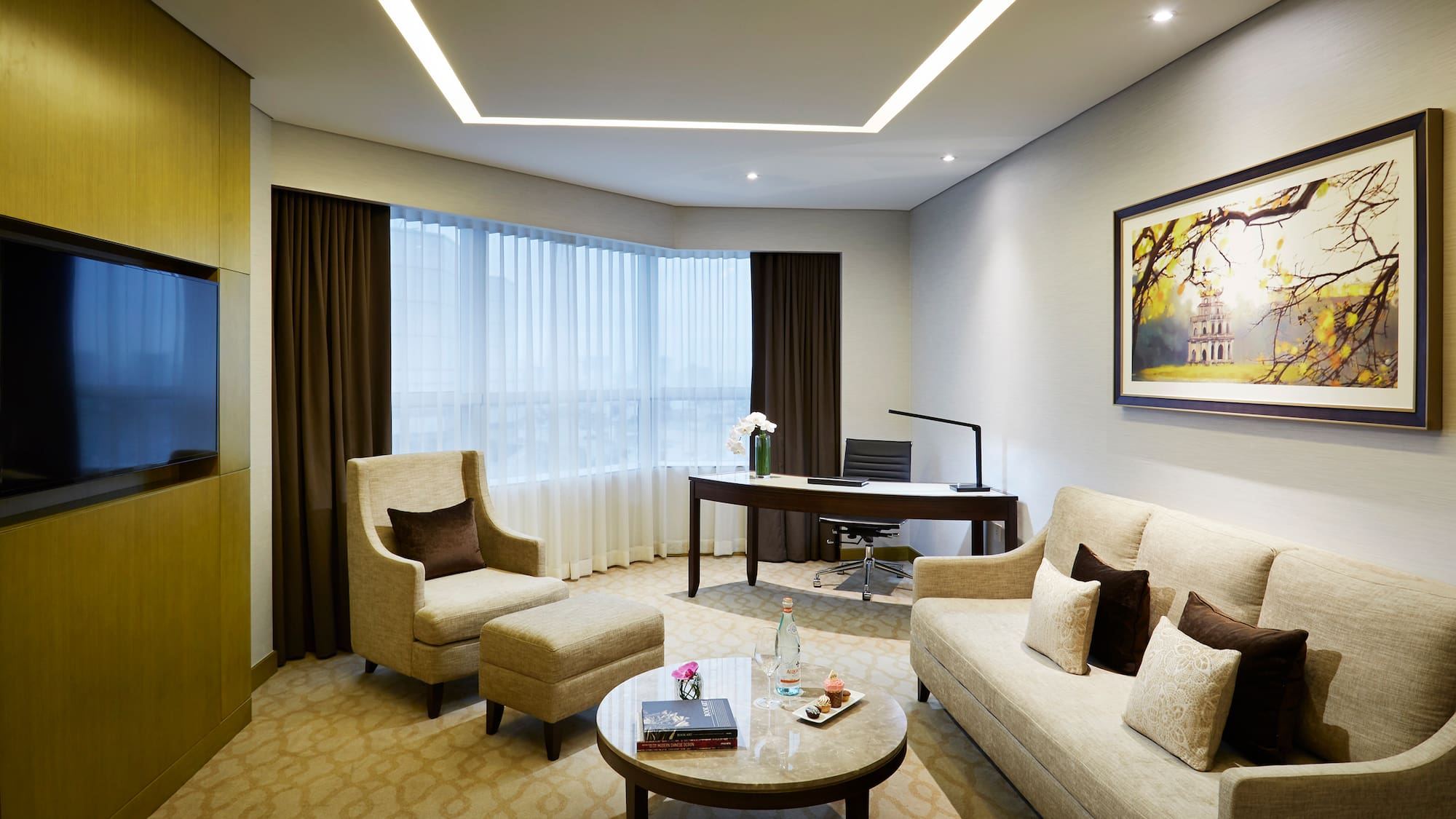 a room with a couch and chairs