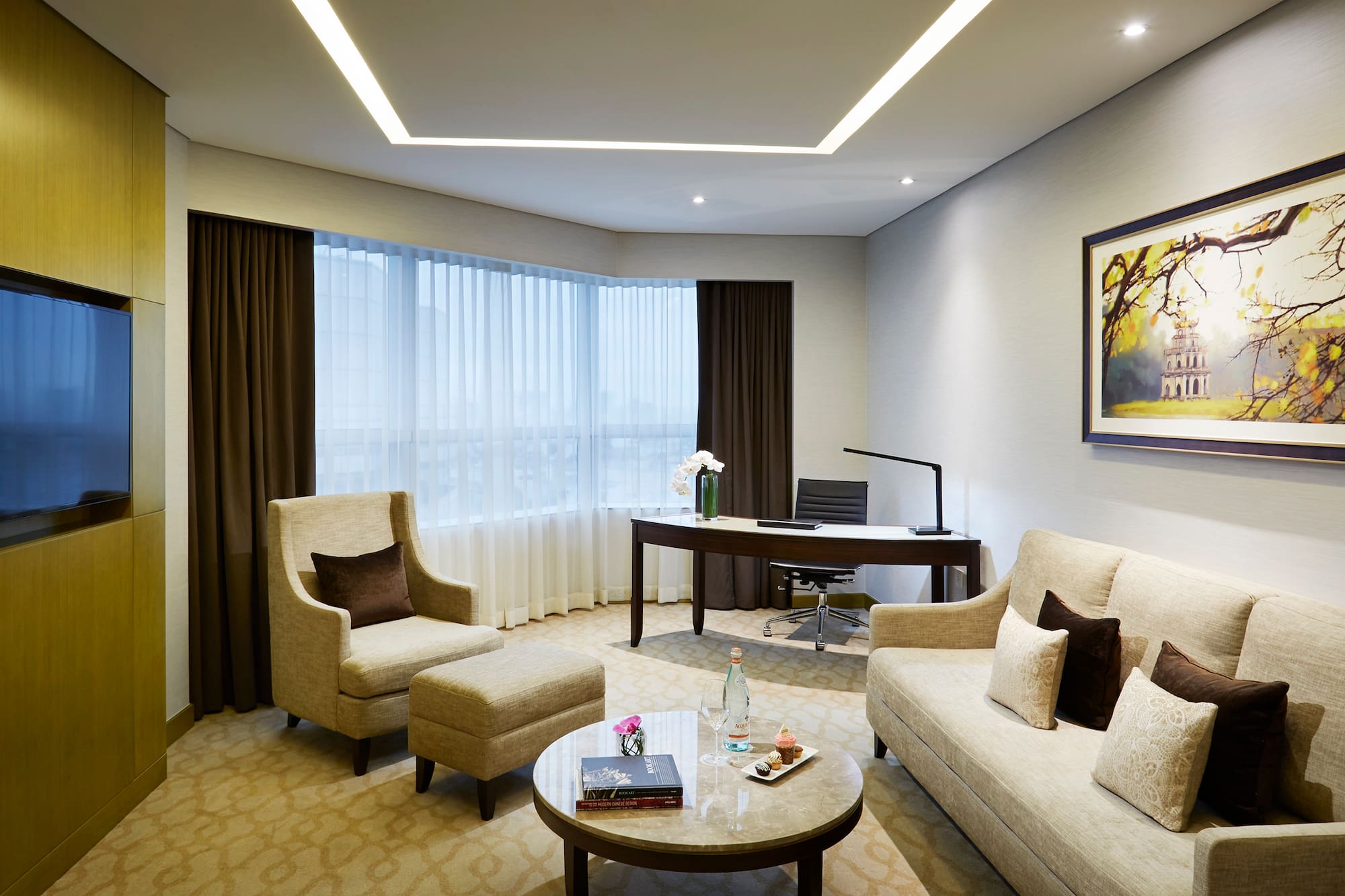 a room with a couch and chairs