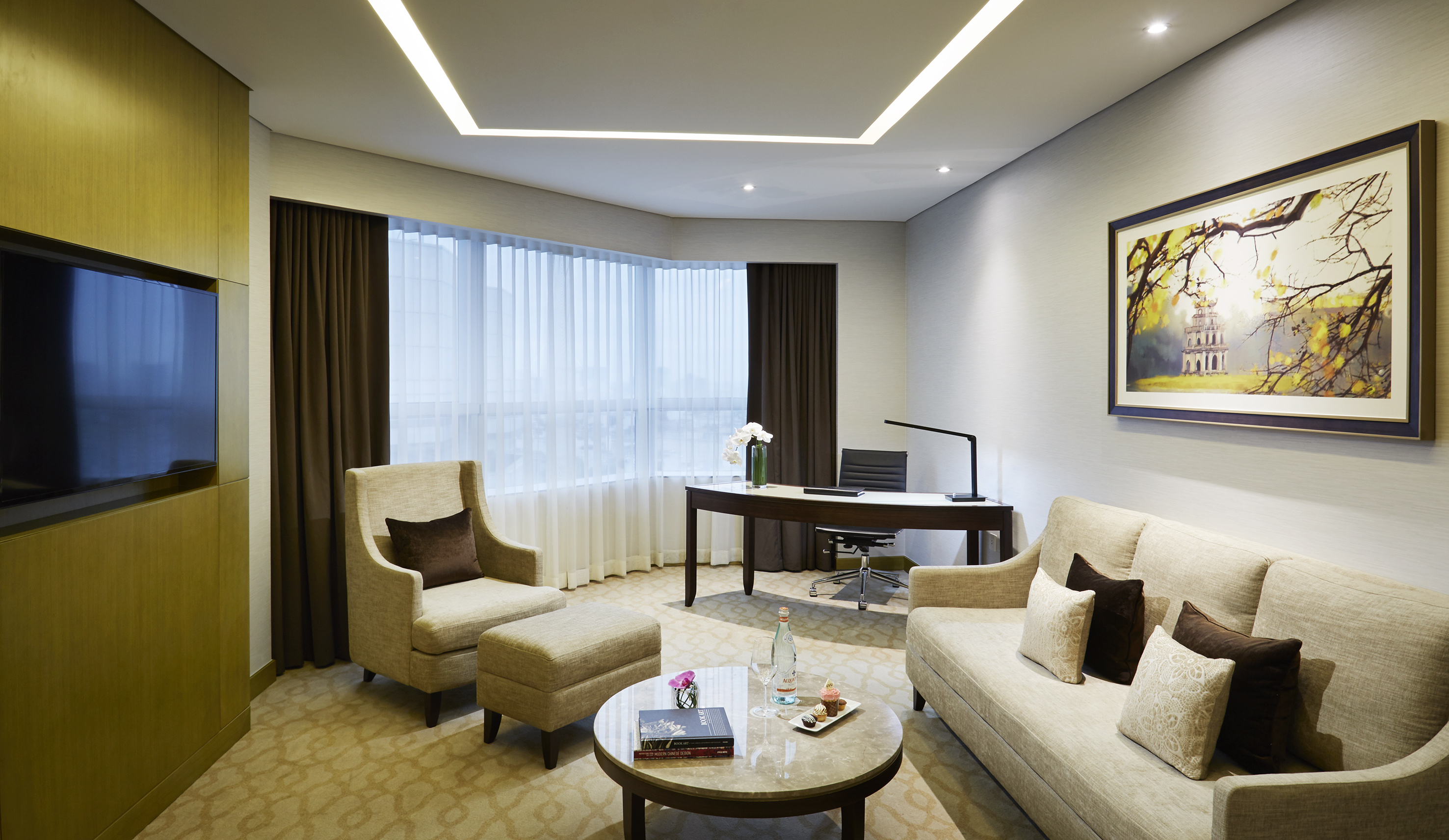 a room with a couch and chairs