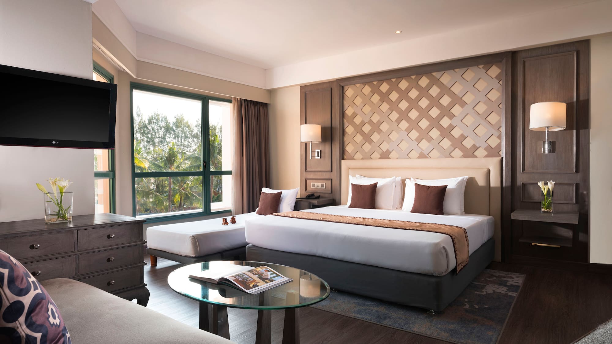 a room with a bed and a television