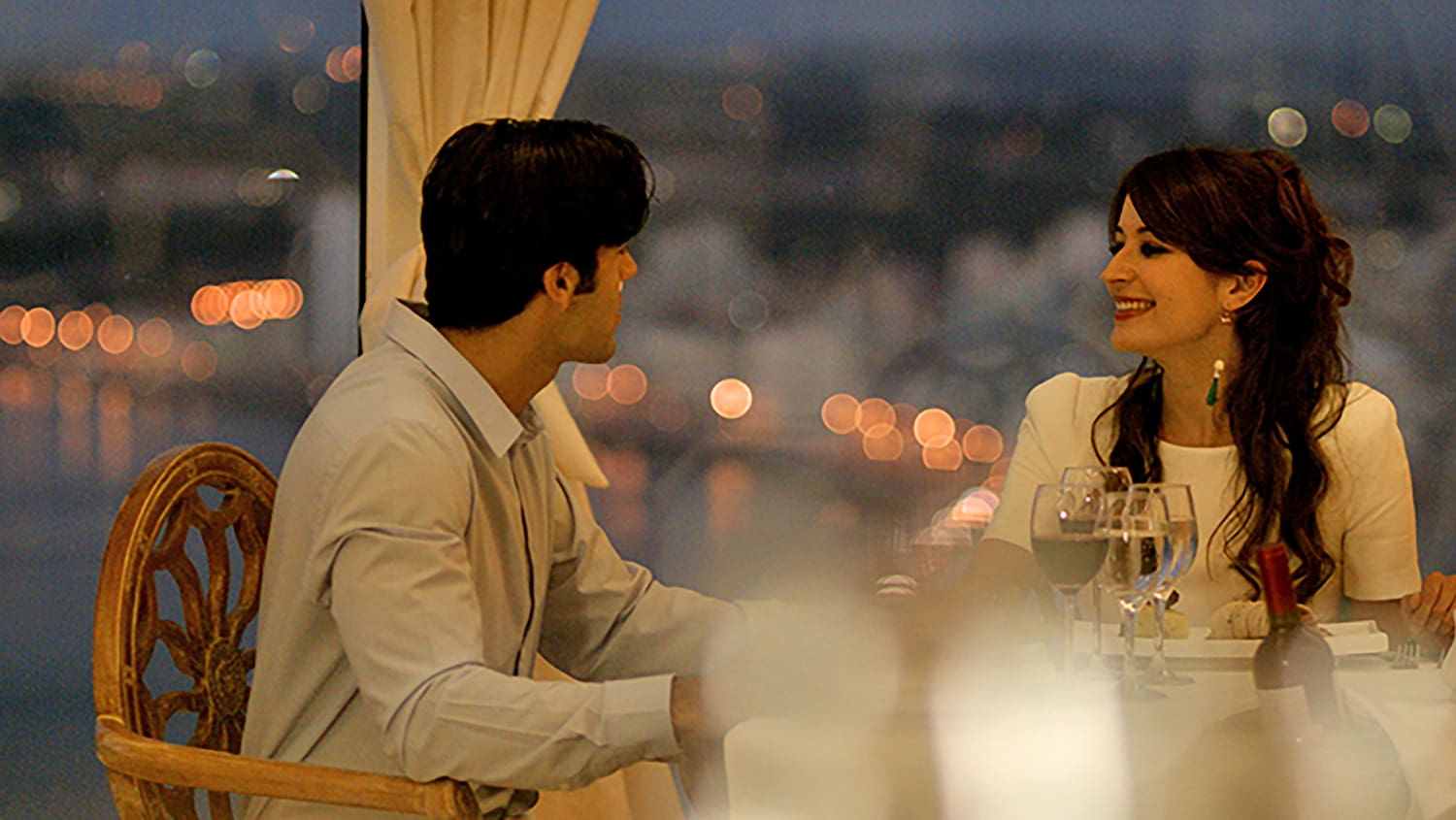 a man and woman sitting at a table