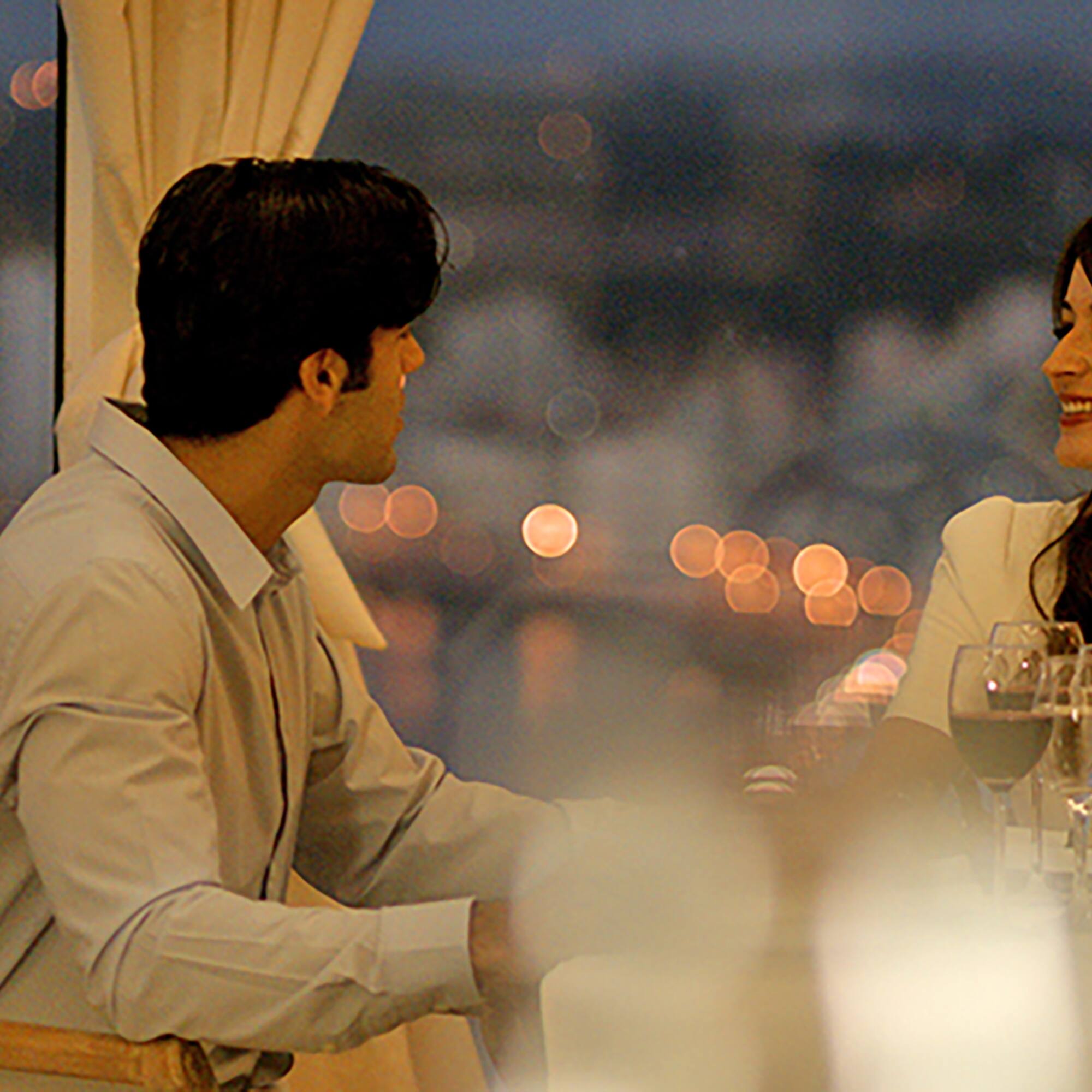 a man and woman sitting at a table