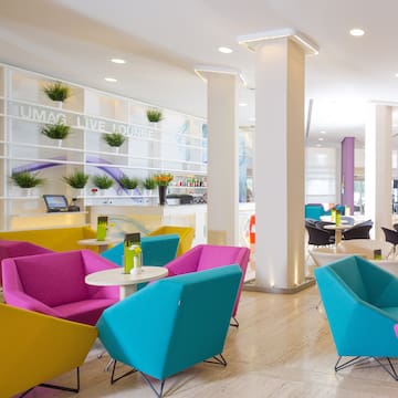 a room with colorful chairs and tables