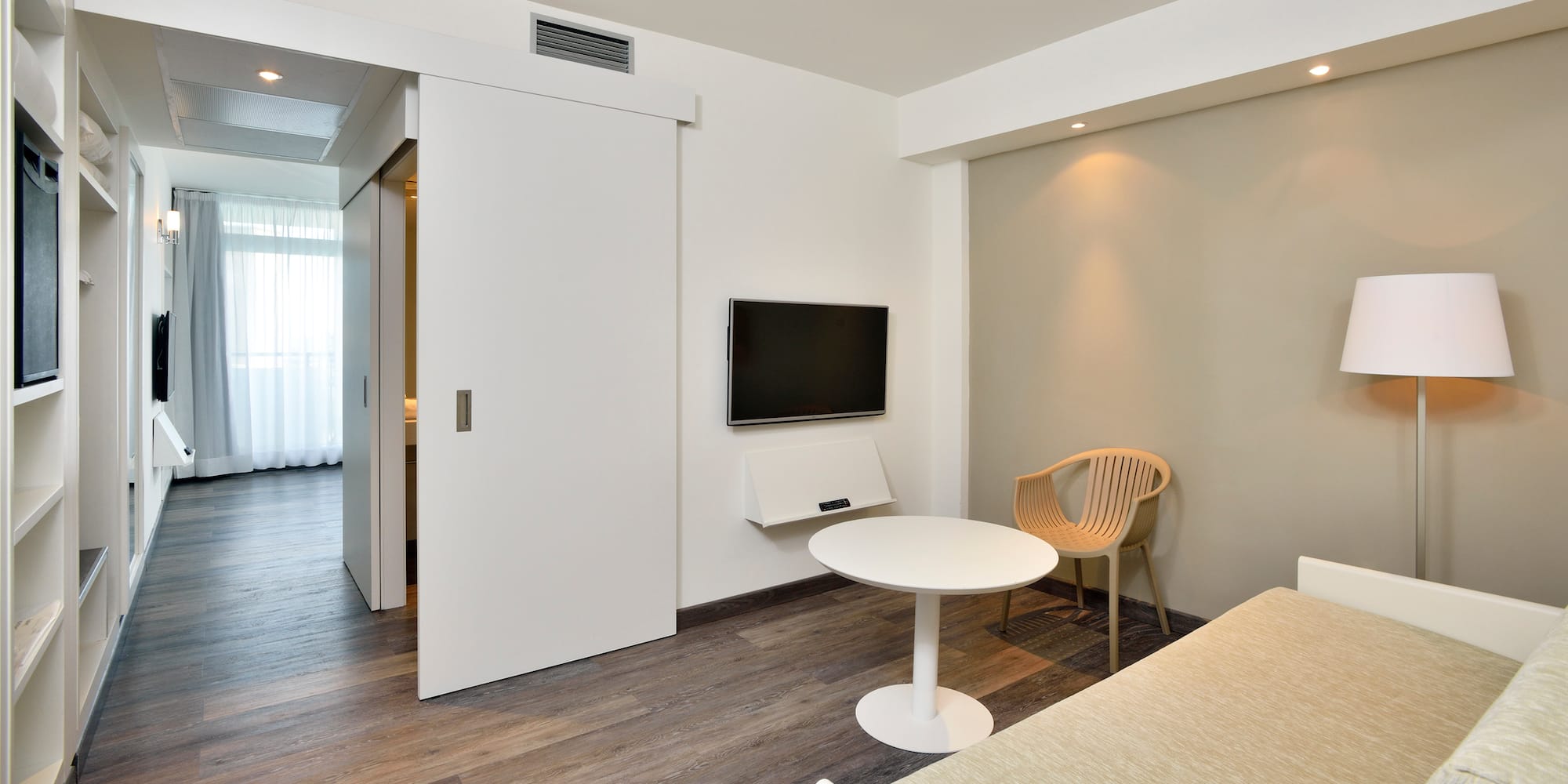 a room with a tv and a table