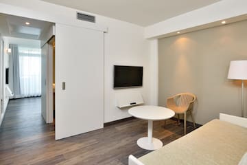 a room with a tv and a table