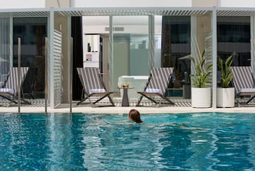 a woman swimming in a pool