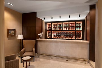 a bar with shelves of liquor bottles