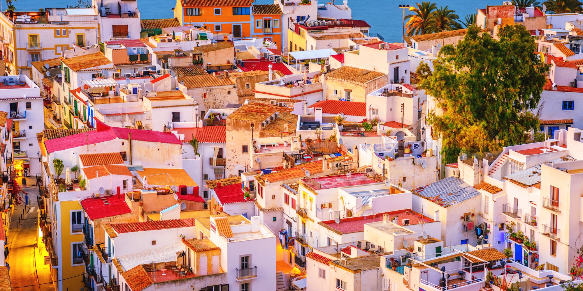 a group of buildings with red roofs