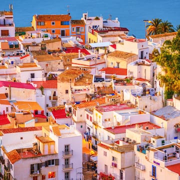 a group of buildings with red roofs