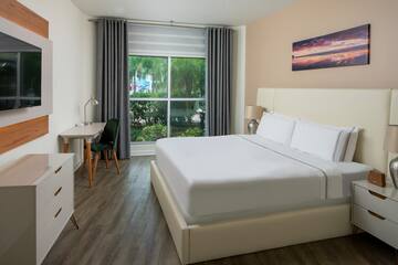 a bedroom with a bed and a desk
