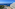 Oceanfront hotel resort with balconies, outdoor terraces, and blue sea.