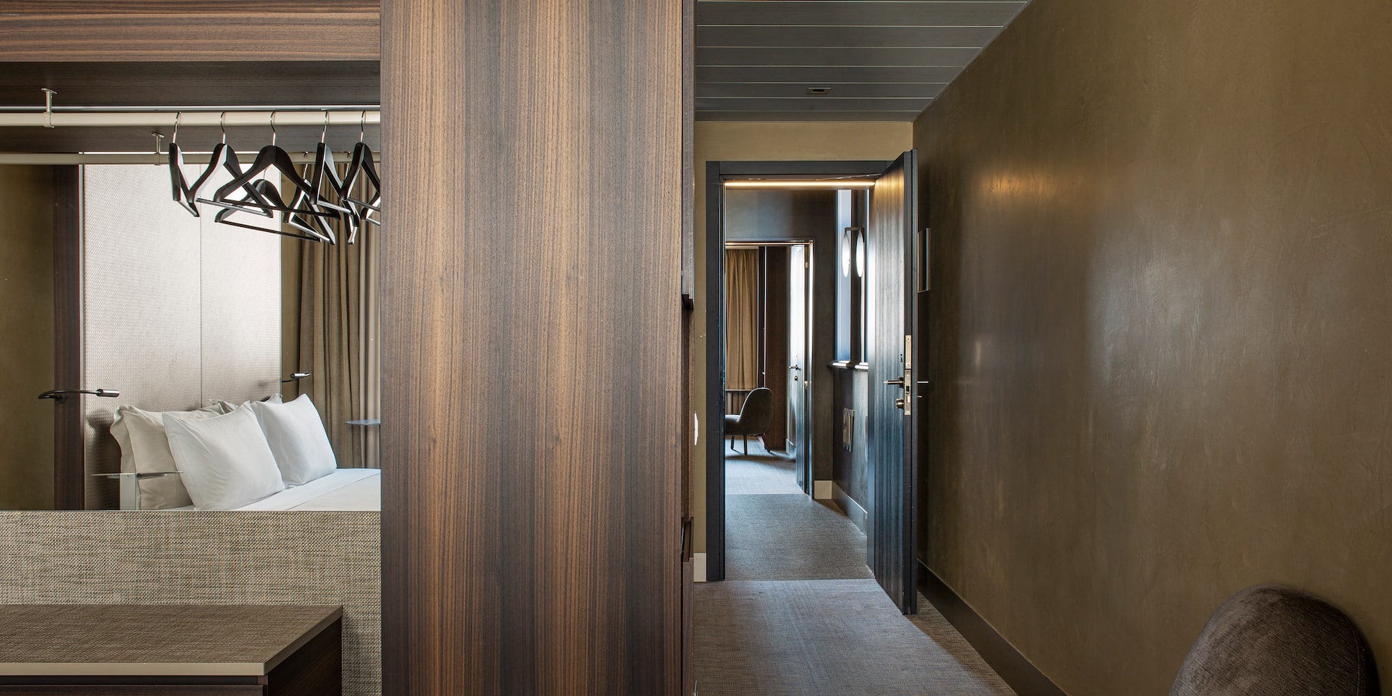 a room with a bed and a mirror