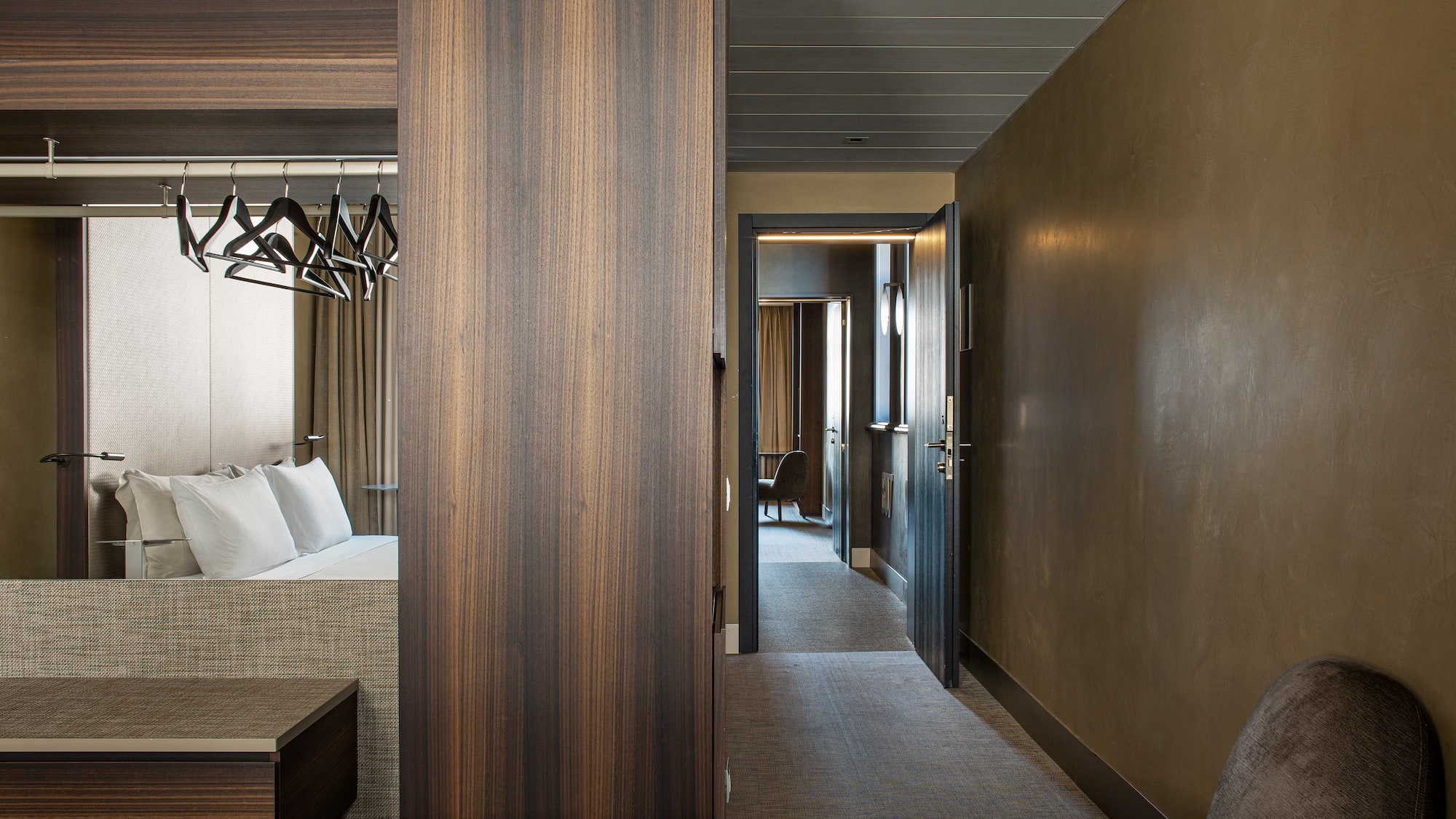 a room with a bed and a mirror