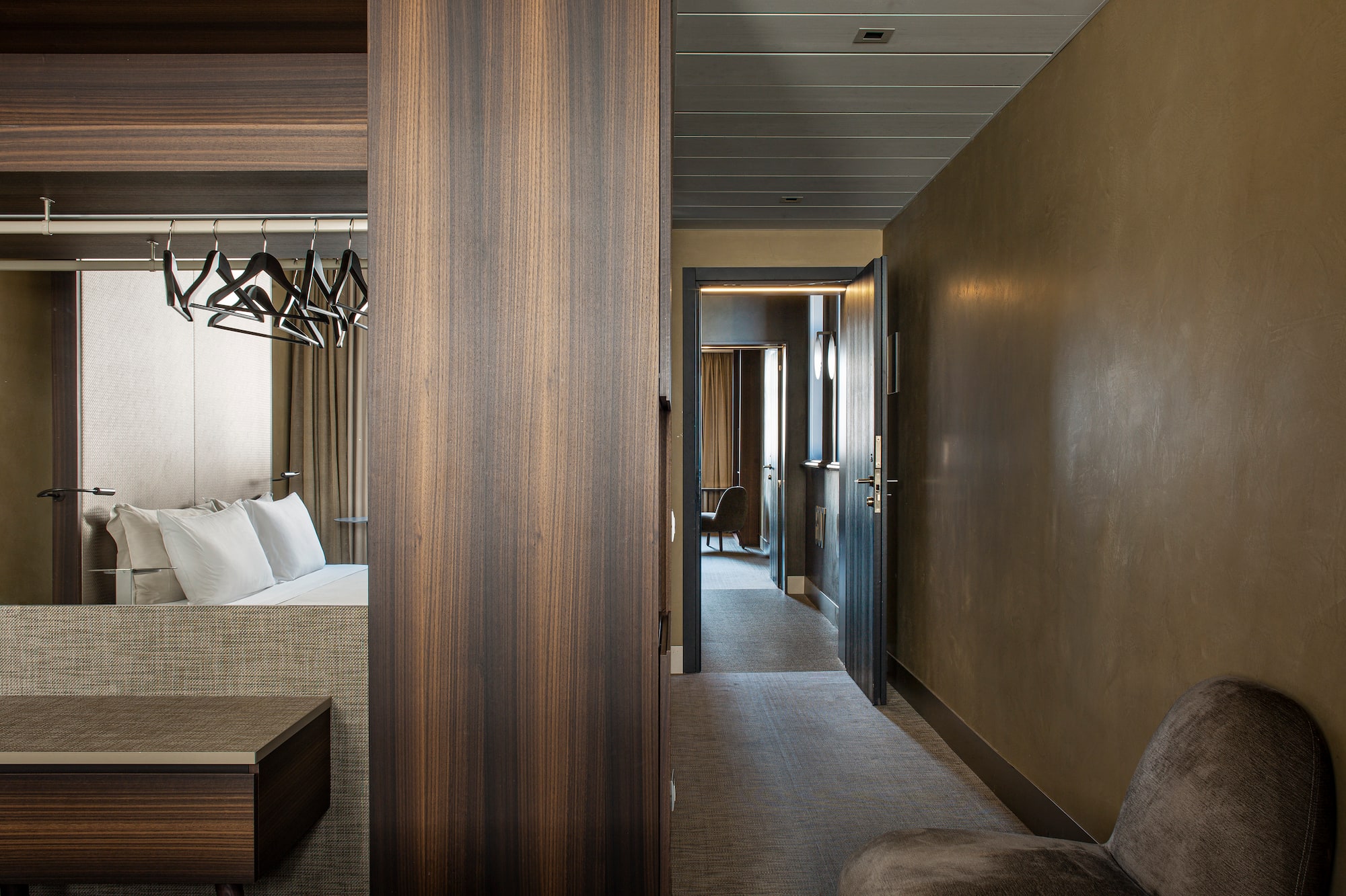 a room with a bed and a mirror