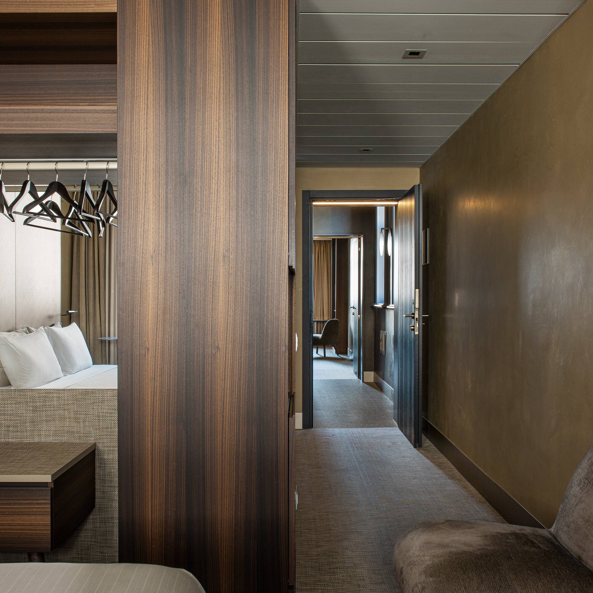 a room with a bed and a mirror