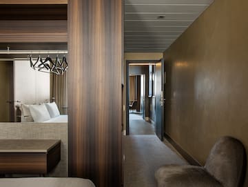 a room with a bed and a mirror