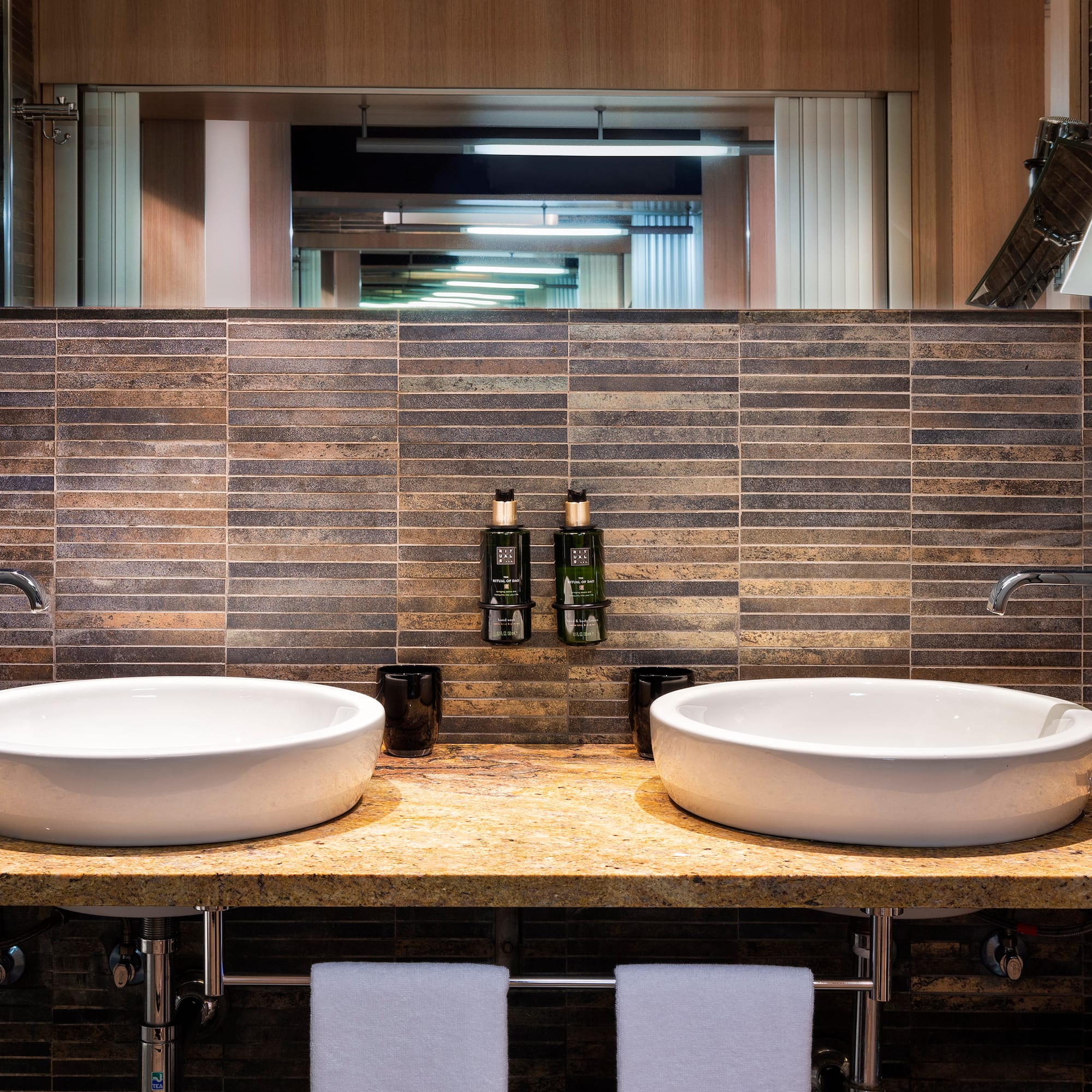 a bathroom with two sinks