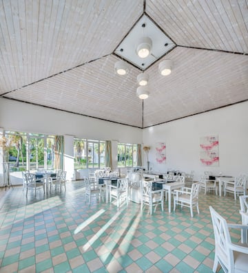 a room with tables and chairs