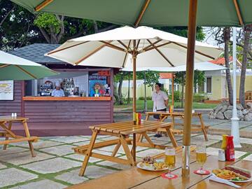 a table and chairs under umbrellas