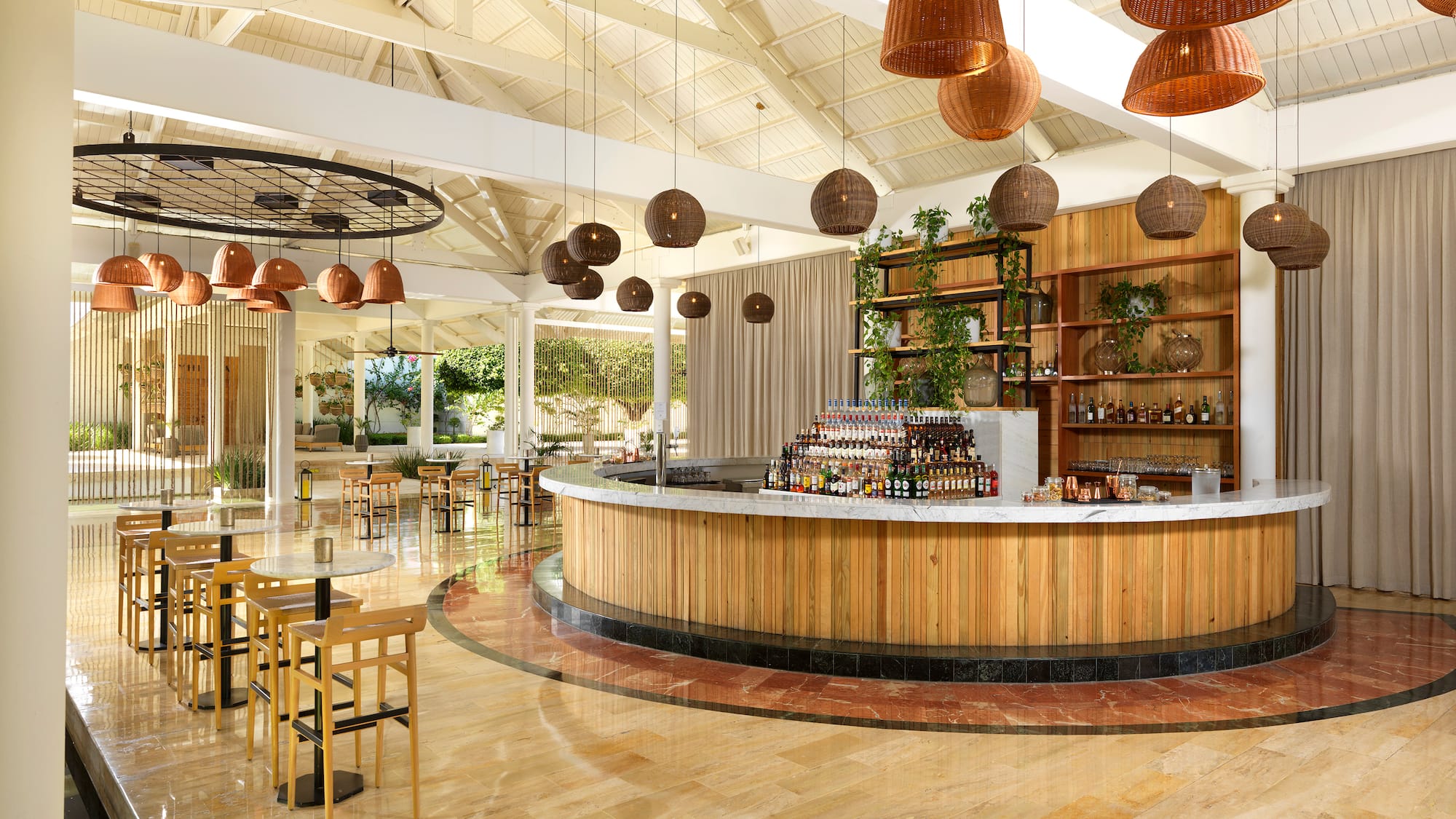 a bar with a counter and chairs