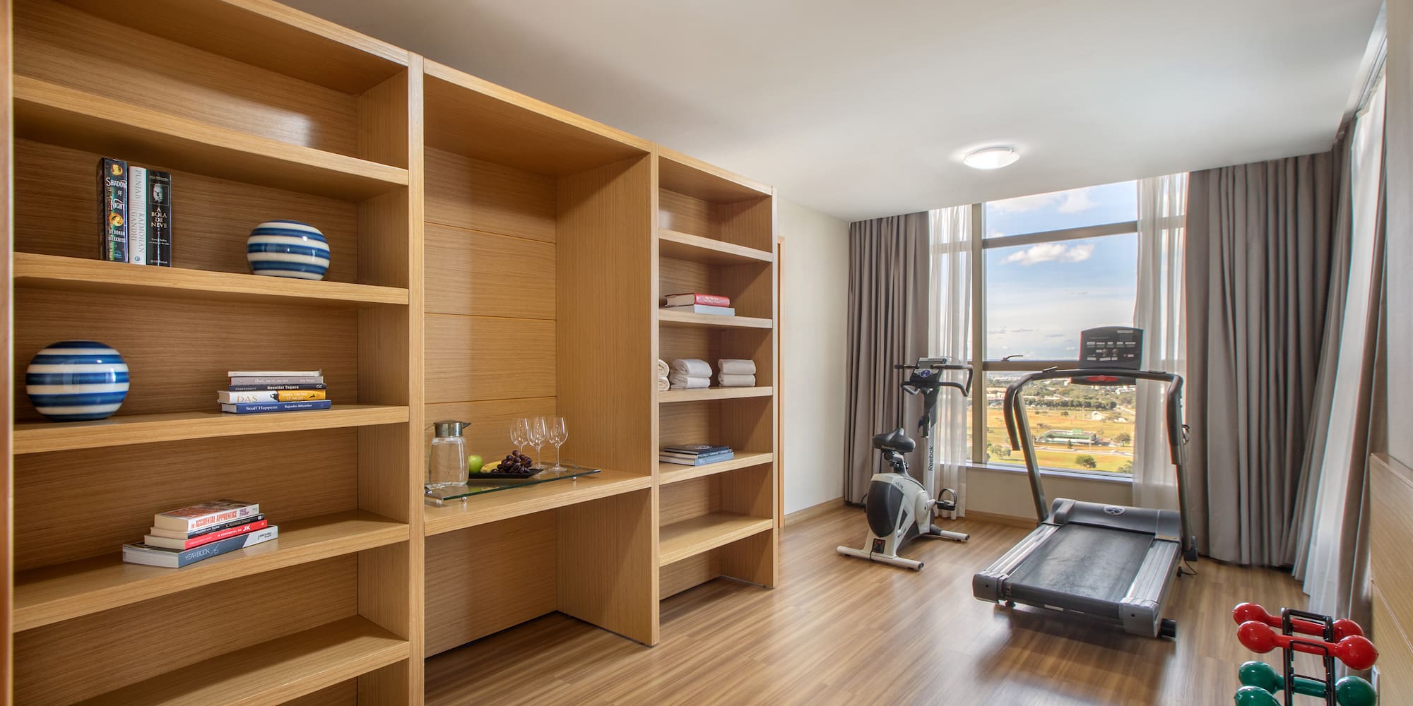 a room with a treadmill and exercise equipment