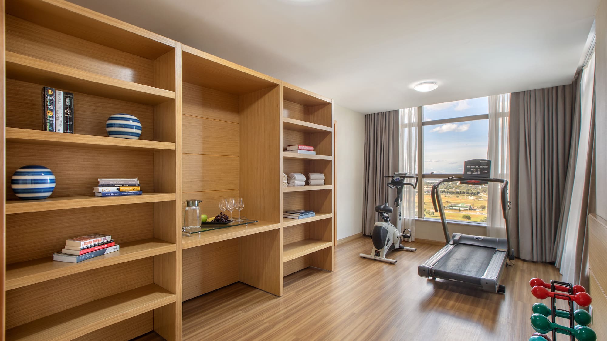 a room with a treadmill and exercise equipment