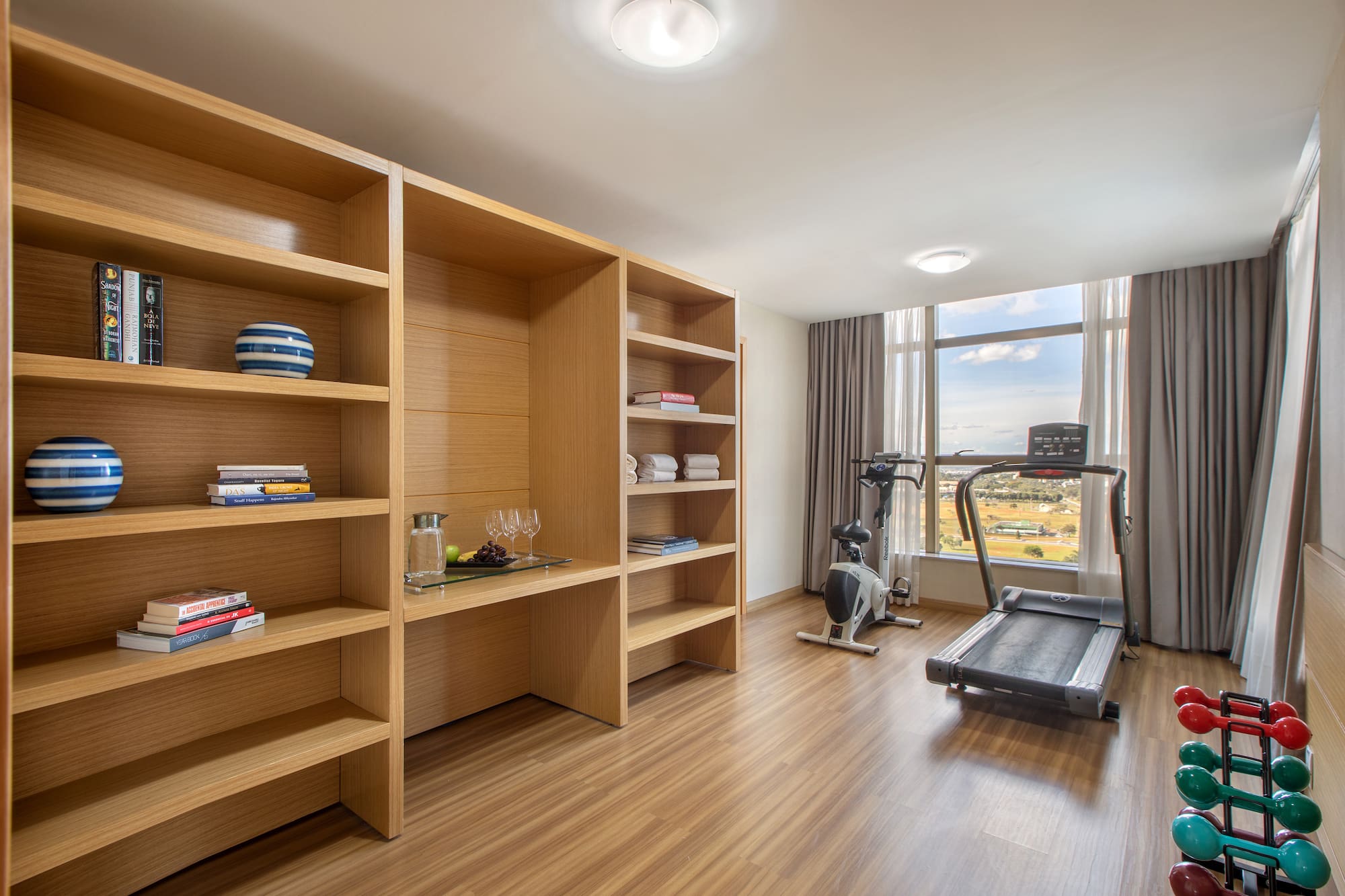 a room with a treadmill and exercise equipment