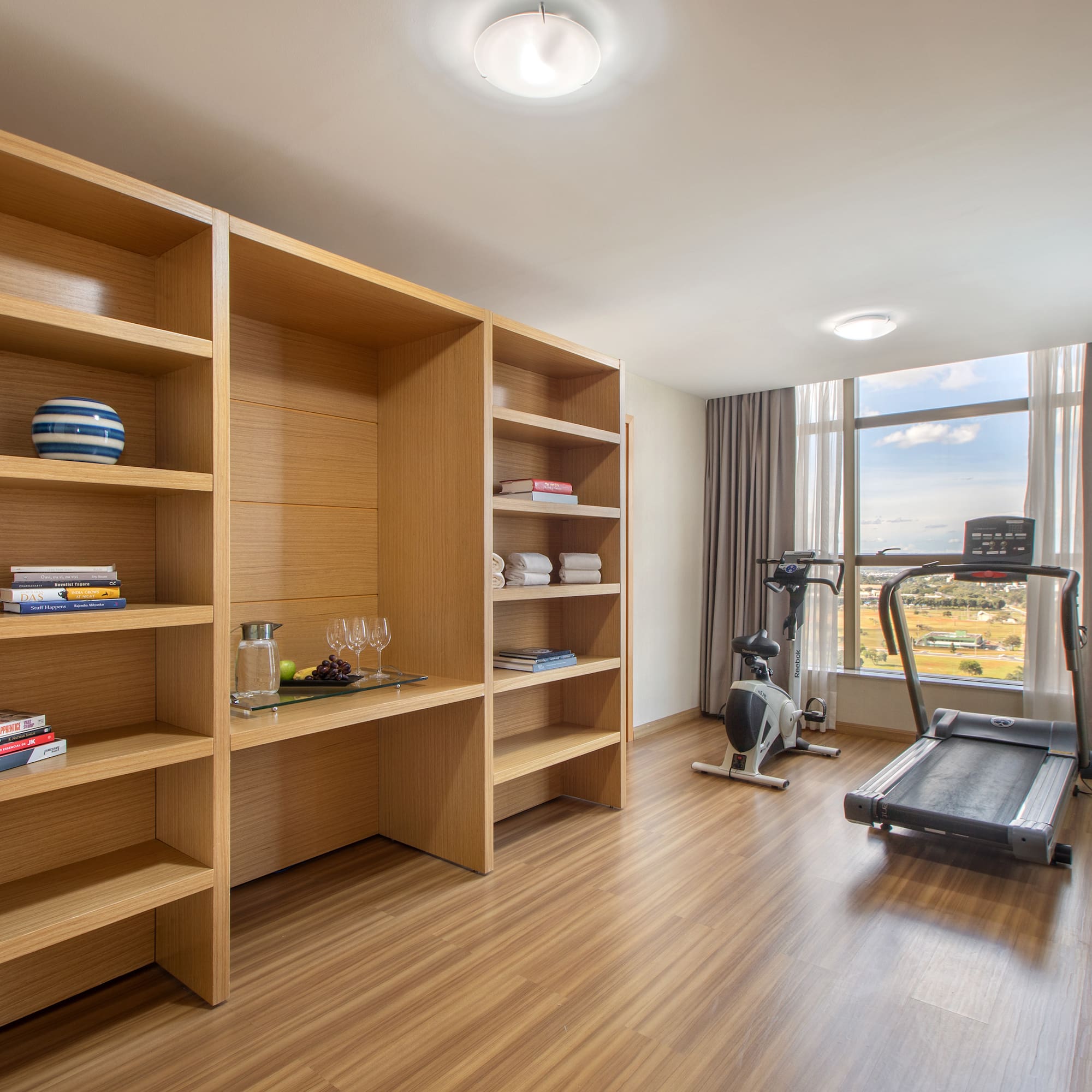 a room with a treadmill and exercise equipment