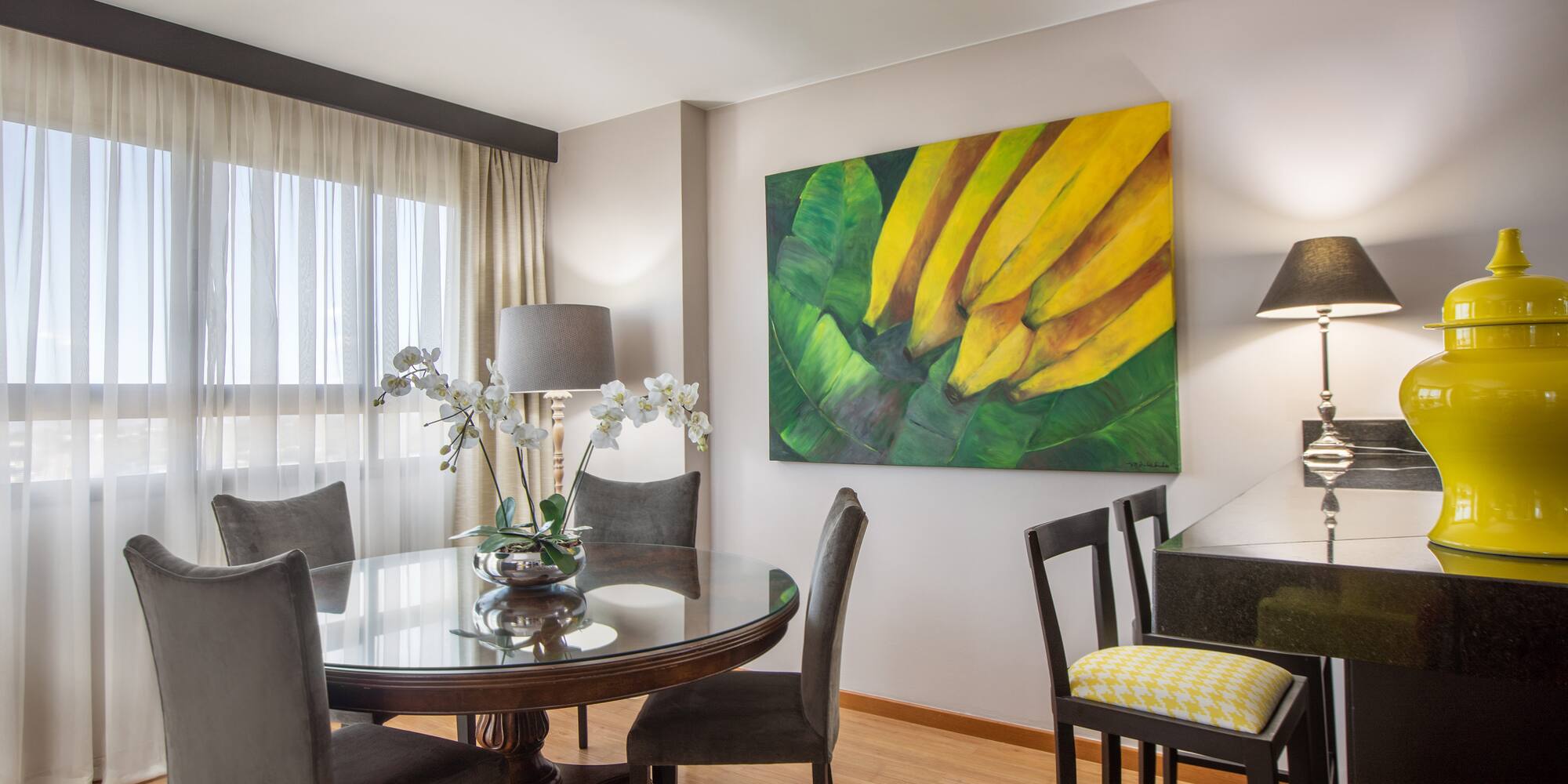 a dining room with a table and chairs